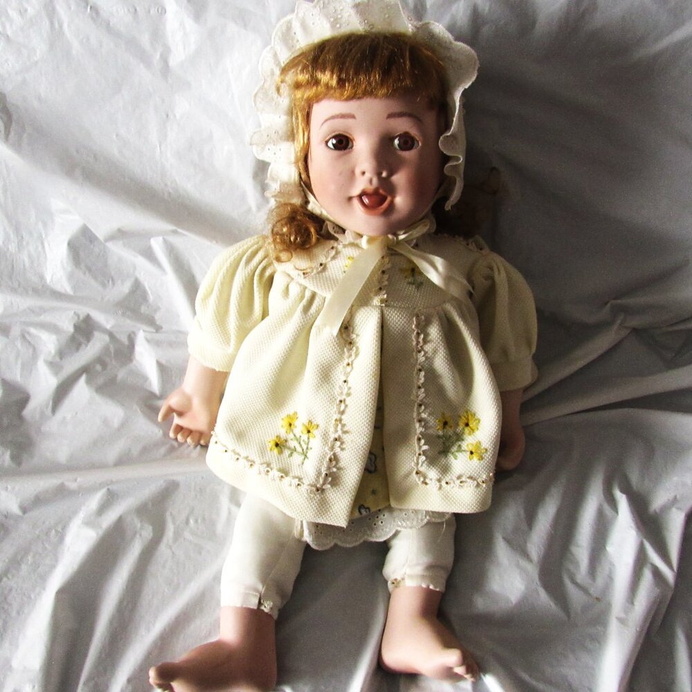 Vintage Doll with Porcelain head, hands and feet.